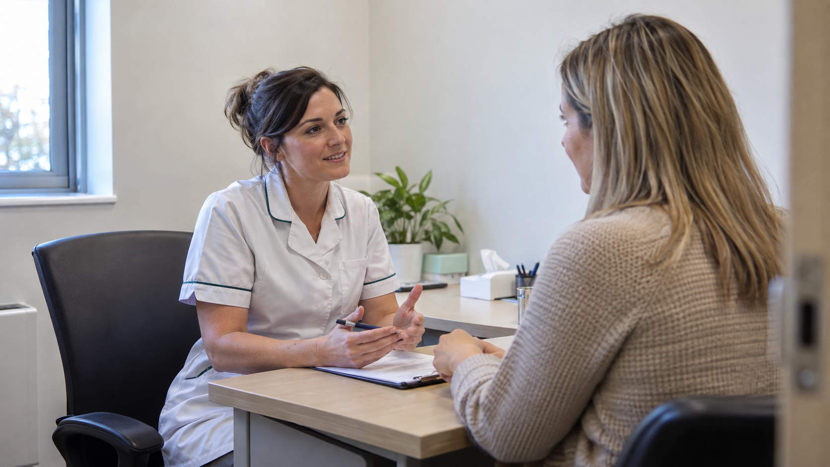 Pharmacist discussing weight loss treatment options during a consultation in Wirral